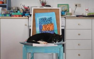 greek cat blue chair artists studio